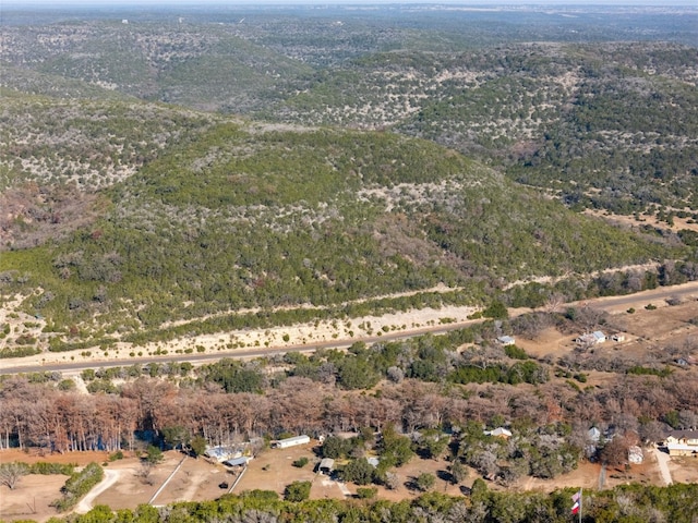 187 N Roy Chisum Rd, Leakey, TX 78873 - aerial view of property and surrounding area featuring a heavily wooded area