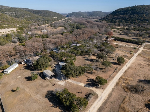 187 N Roy Chisum Rd, Leakey, TX 78873 - aerial overview of property's location featuring a mountainous background and rural landscape