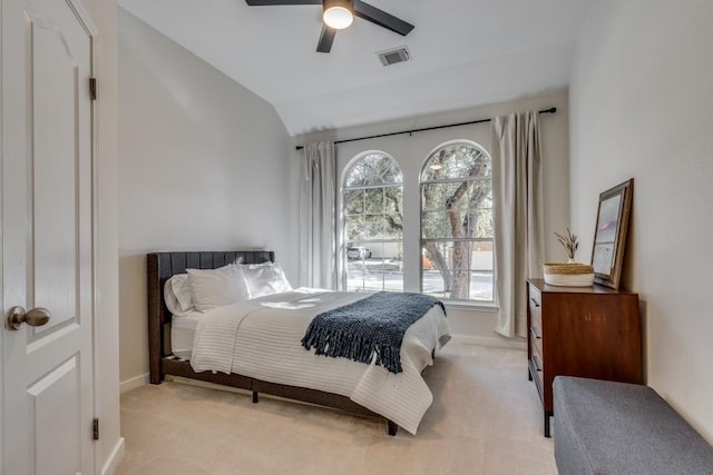 carpeted bedroom with ceiling fan and lofted ceiling