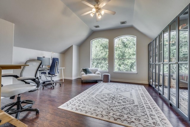 office space with vaulted ceiling, a wealth of natural light, ceiling fan, and dark hardwood / wood-style floors