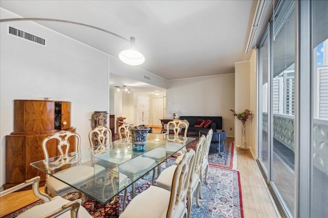 dining space with light wood-type flooring