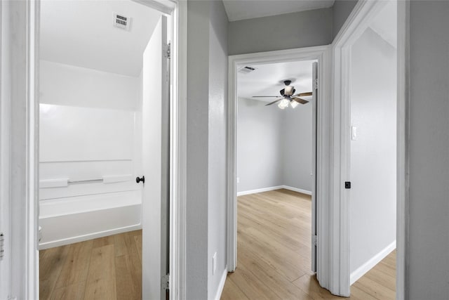 hallway featuring light wood-type flooring