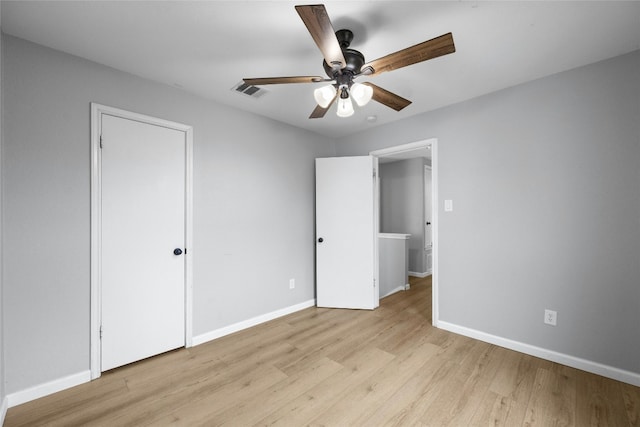 unfurnished bedroom featuring ceiling fan and light hardwood / wood-style flooring