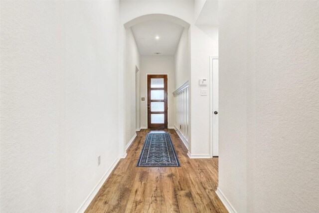 corridor featuring wood-type flooring