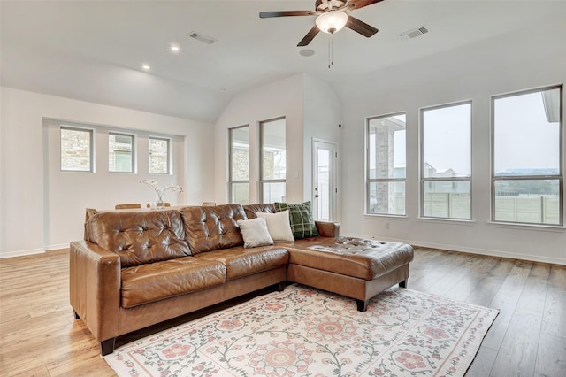 living room with vaulted ceiling, ceiling fan, and light hardwood / wood-style flooring