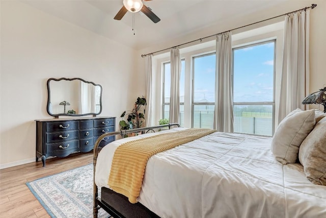 bedroom with ceiling fan and light wood-type flooring