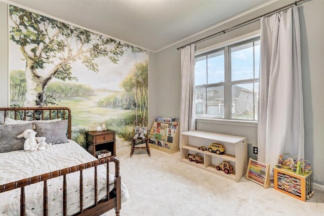 carpeted bedroom with crown molding and a textured ceiling