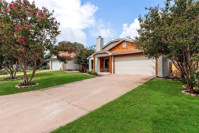 view of front of house with a front lawn and a garage