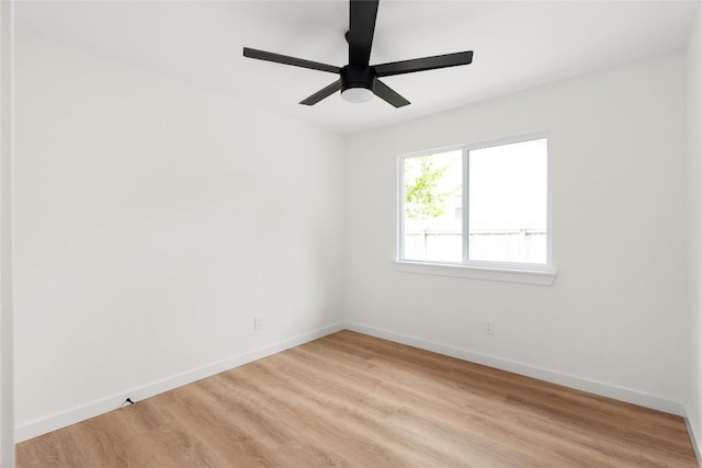 unfurnished room featuring ceiling fan and light wood-type flooring