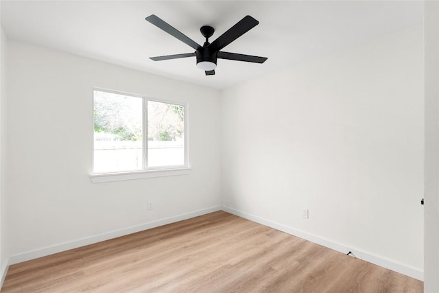 empty room featuring ceiling fan and light wood-type flooring