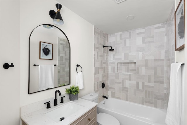 full bathroom featuring vanity, shower / bath combo, and toilet