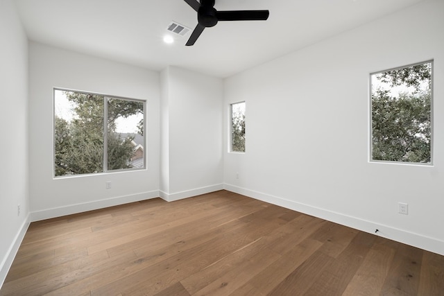 spare room with ceiling fan and hardwood / wood-style floors