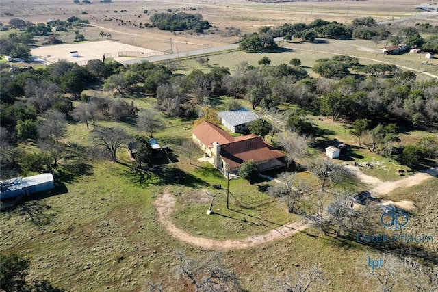 birds eye view of property with a rural view