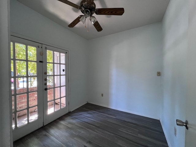 unfurnished room with ceiling fan, dark wood-type flooring, and french doors