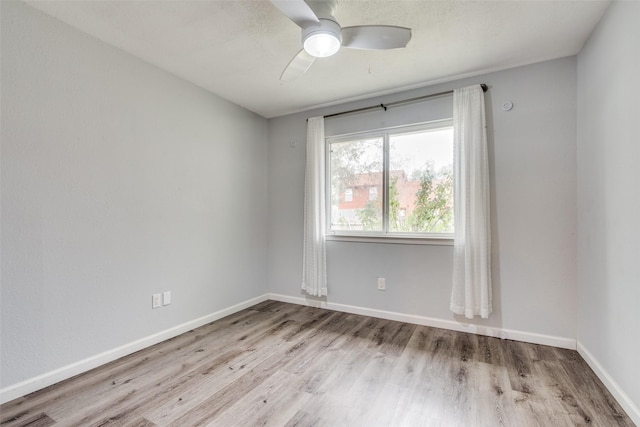 unfurnished room featuring light hardwood / wood-style flooring and ceiling fan