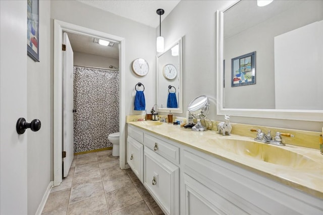 bathroom with a shower with shower curtain, a textured ceiling, vanity, and toilet