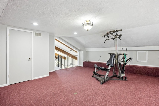 workout area featuring carpet, a textured ceiling, and vaulted ceiling