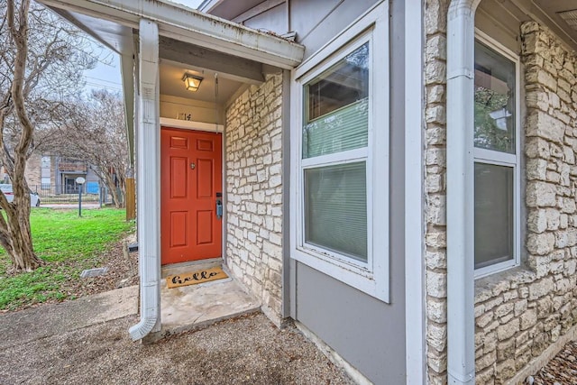 entrance to property with stone siding