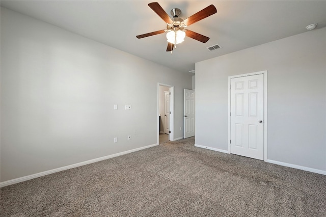 unfurnished bedroom with carpet floors, baseboards, visible vents, and a ceiling fan