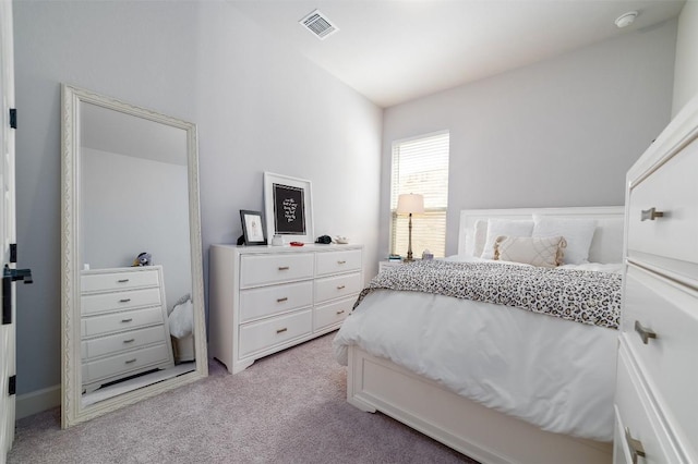 bedroom with light carpet