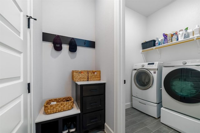 clothes washing area with separate washer and dryer