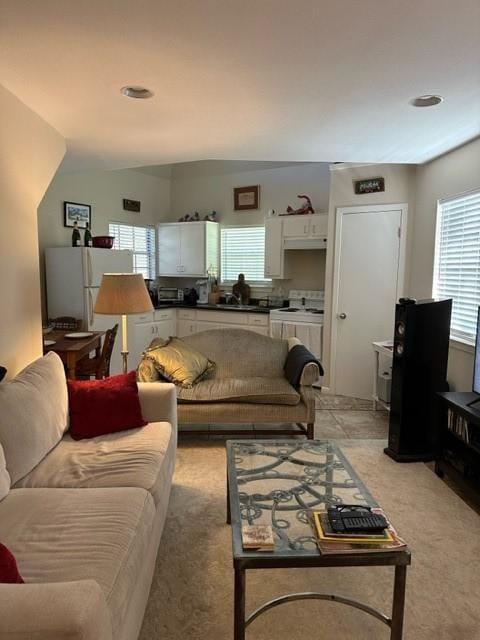 carpeted living room featuring plenty of natural light