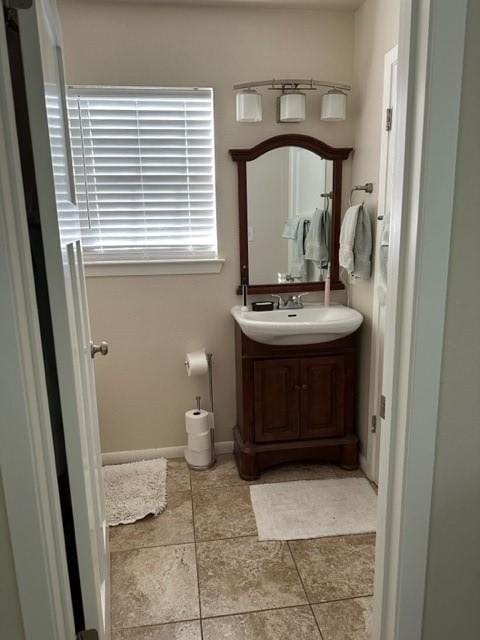 bathroom featuring tile patterned floors and vanity