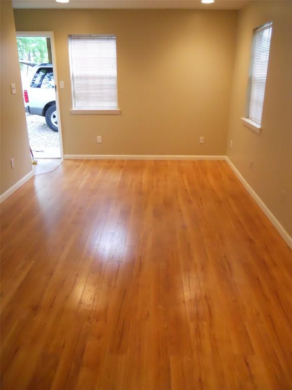 unfurnished room with light hardwood / wood-style floors