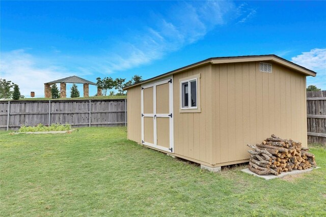 view of outdoor structure with a yard