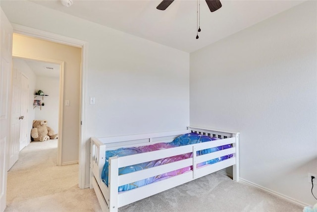 bedroom with light carpet and ceiling fan