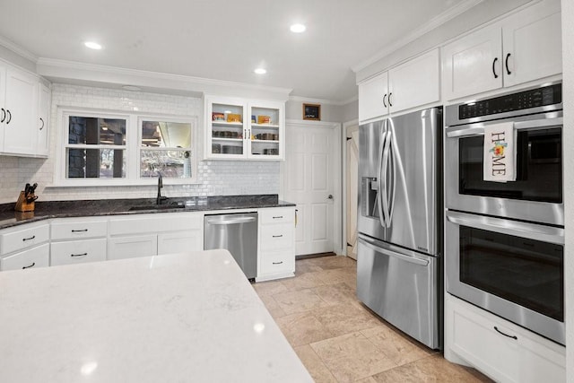 408 Silver Spur, Horseshoe Bay, TX 78657 - kitchen with stainless steel appliances, tasteful backsplash, ornamental molding, white cabinetry, and glass insert cabinets