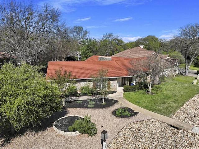 408 Silver Spur, Horseshoe Bay, TX 78657 - view of front of house with a tile roof and a front lawn
