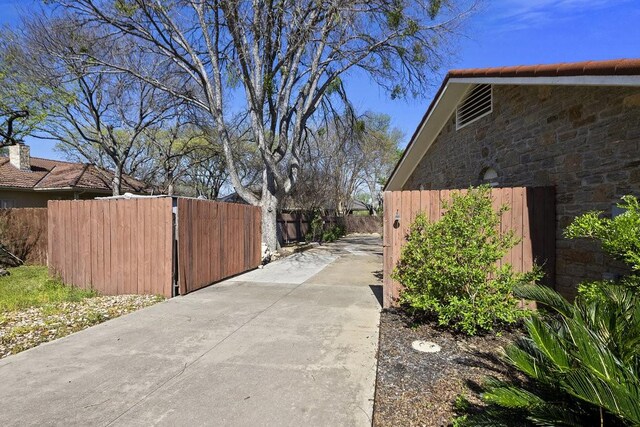 408 Silver Spur, Horseshoe Bay, TX 78657 - view of property exterior featuring concrete driveway
