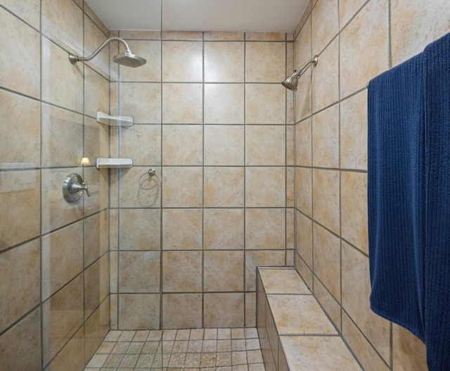 bathroom with a tile shower