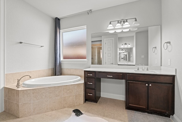 bathroom with shower with separate bathtub, vanity, and tile patterned floors