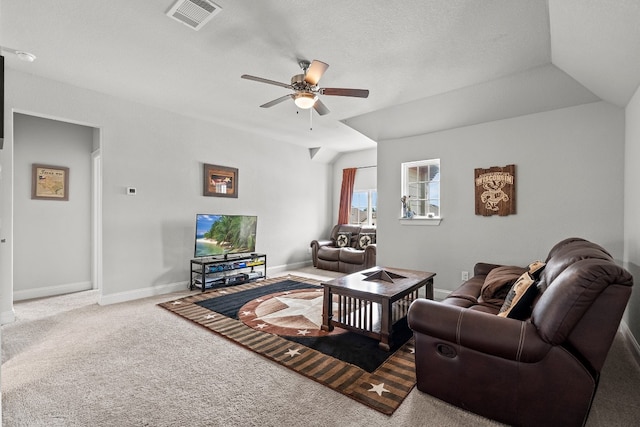 living room with carpet, vaulted ceiling, and ceiling fan