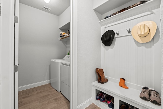 clothes washing area featuring washing machine and dryer