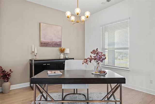 home office with an inviting chandelier, light wood-style flooring, visible vents, and baseboards