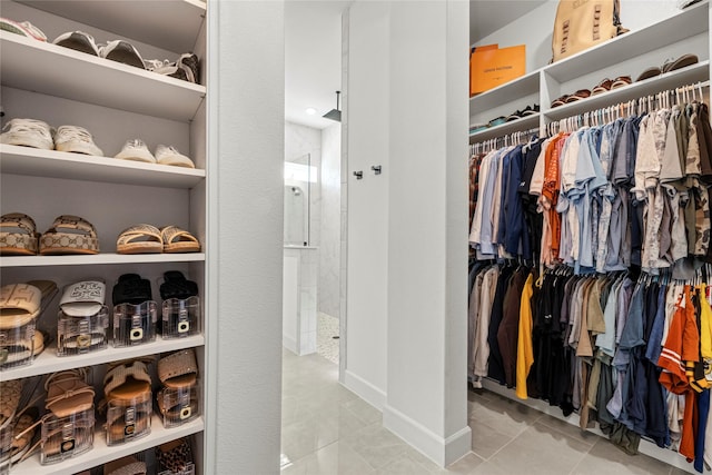 spacious closet with light tile patterned floors