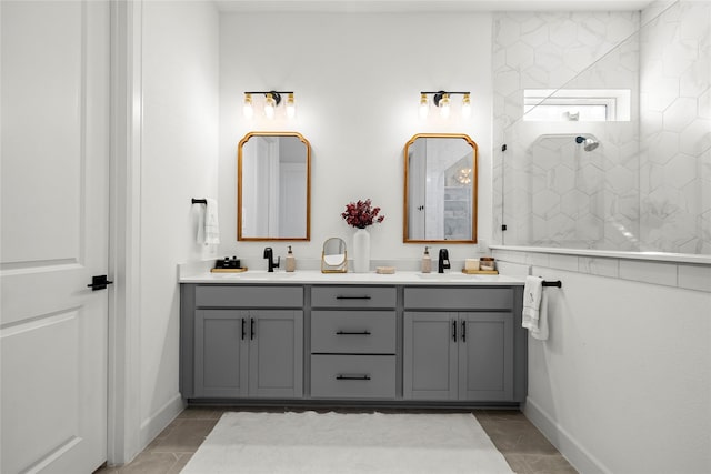 full bathroom with tile patterned floors, double vanity, a sink, and walk in shower