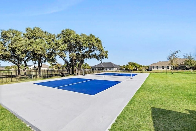 view of pool featuring tennis court and a lawn