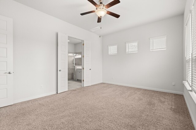 1813 Arapaho Mountain Pass, Leander, TX 78641 - unfurnished bedroom with light colored carpet, connected bathroom, and a ceiling fan