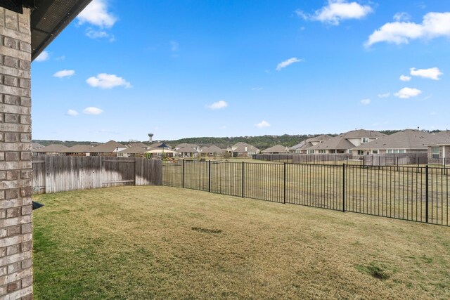 1813 Arapaho Mountain Pass, Leander, TX 78641 - fenced backyard with a residential view
