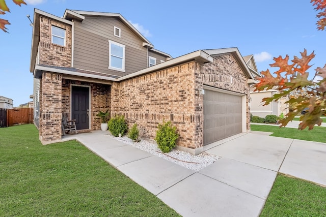 view of front of house featuring a front yard and a garage