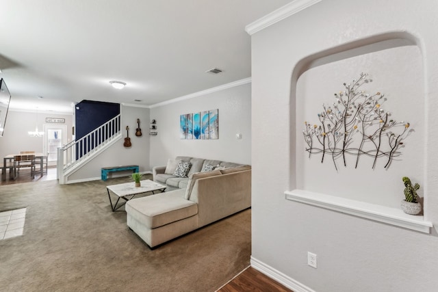 living room featuring a notable chandelier and ornamental molding