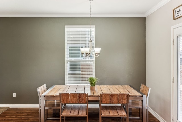 dining space with an inviting chandelier, dark hardwood / wood-style floors, and ornamental molding