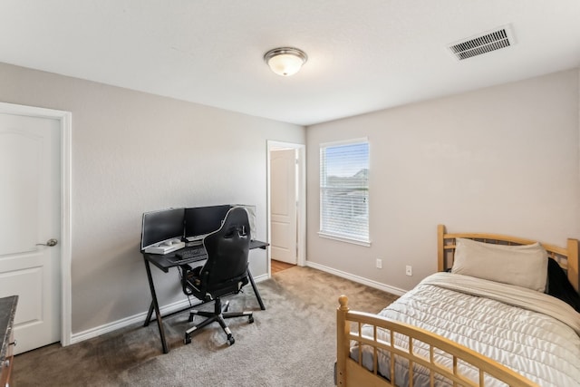 bedroom featuring dark carpet