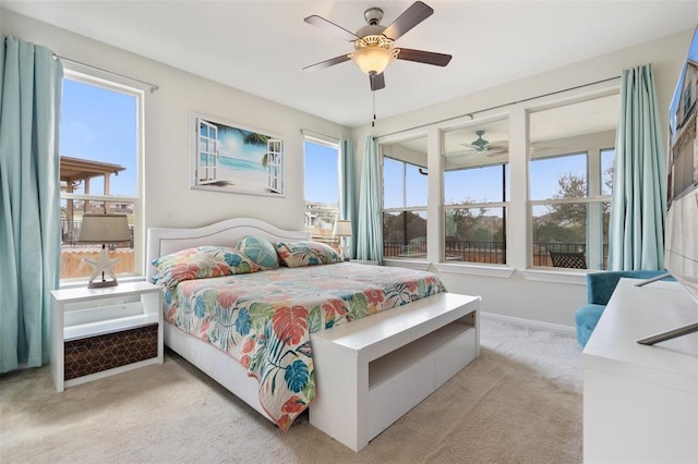 bedroom featuring ceiling fan and light colored carpet