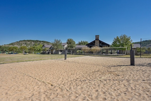 view of community featuring volleyball court and a mountain view