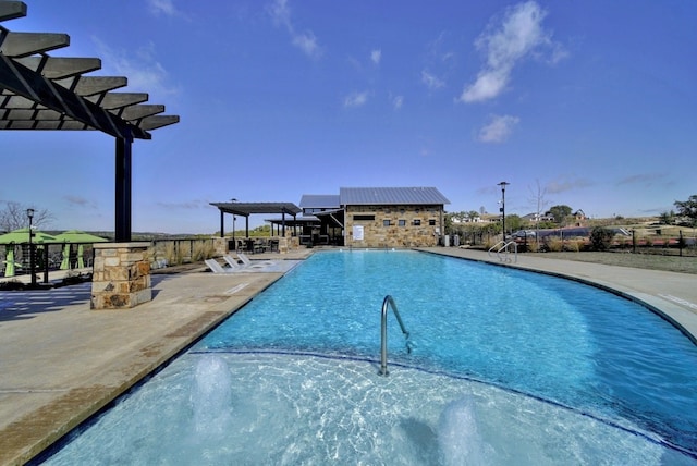 view of pool featuring a patio